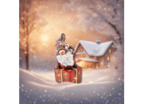 Figurka LED Święty Mikołaj na prezencie 42,1 x 19,8 cm